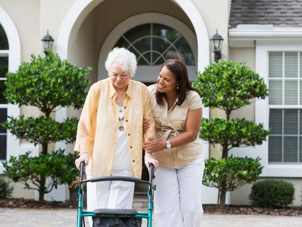 caregiver-walking-with-elderly-outside senior home care in Massachusetts