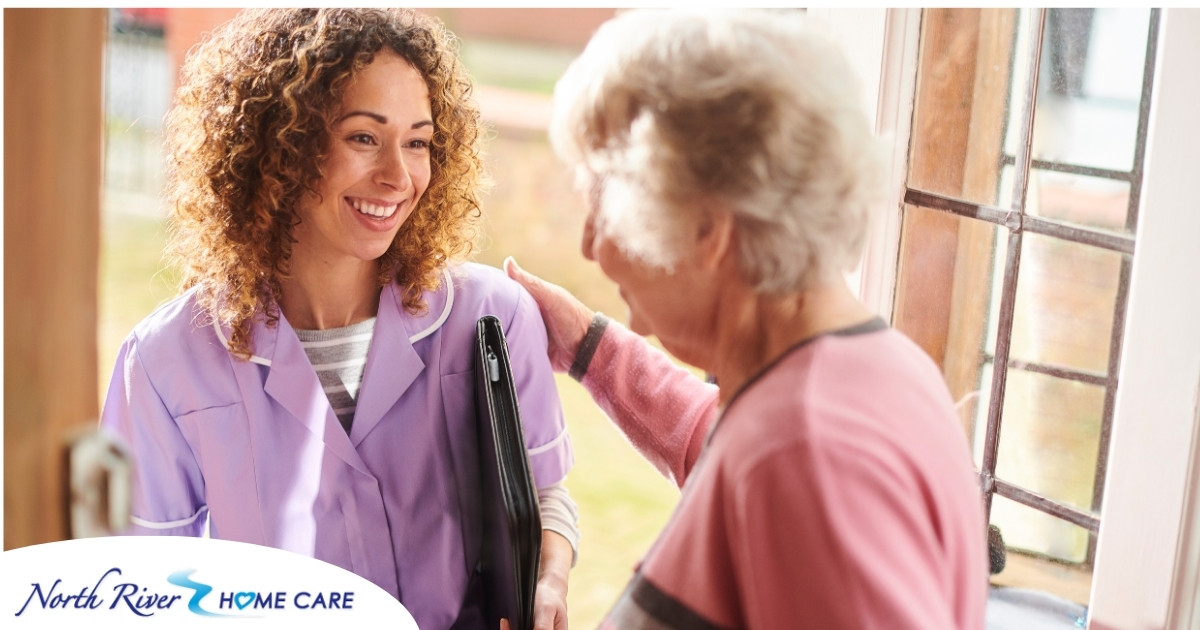 A happy caregiver enters the home of a client, representing in-home recovery care.