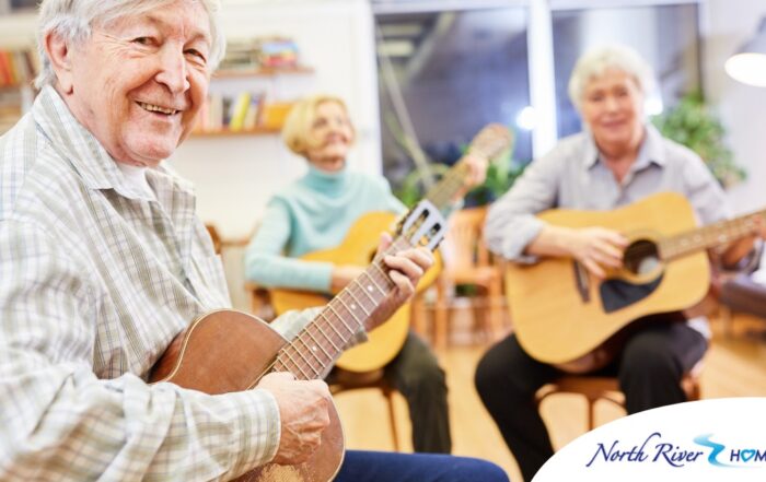 A group of seniors enjoy playing instruments together showing the impact of music for older adults.