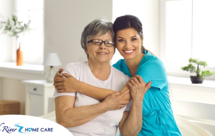 A caregiver hugs an older client, representing how a trustworthy caregiver cares for clients.