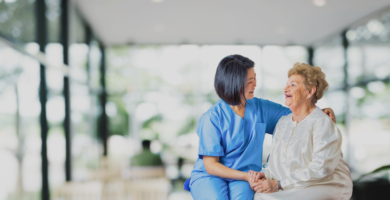 Home health assistant helping senior woman